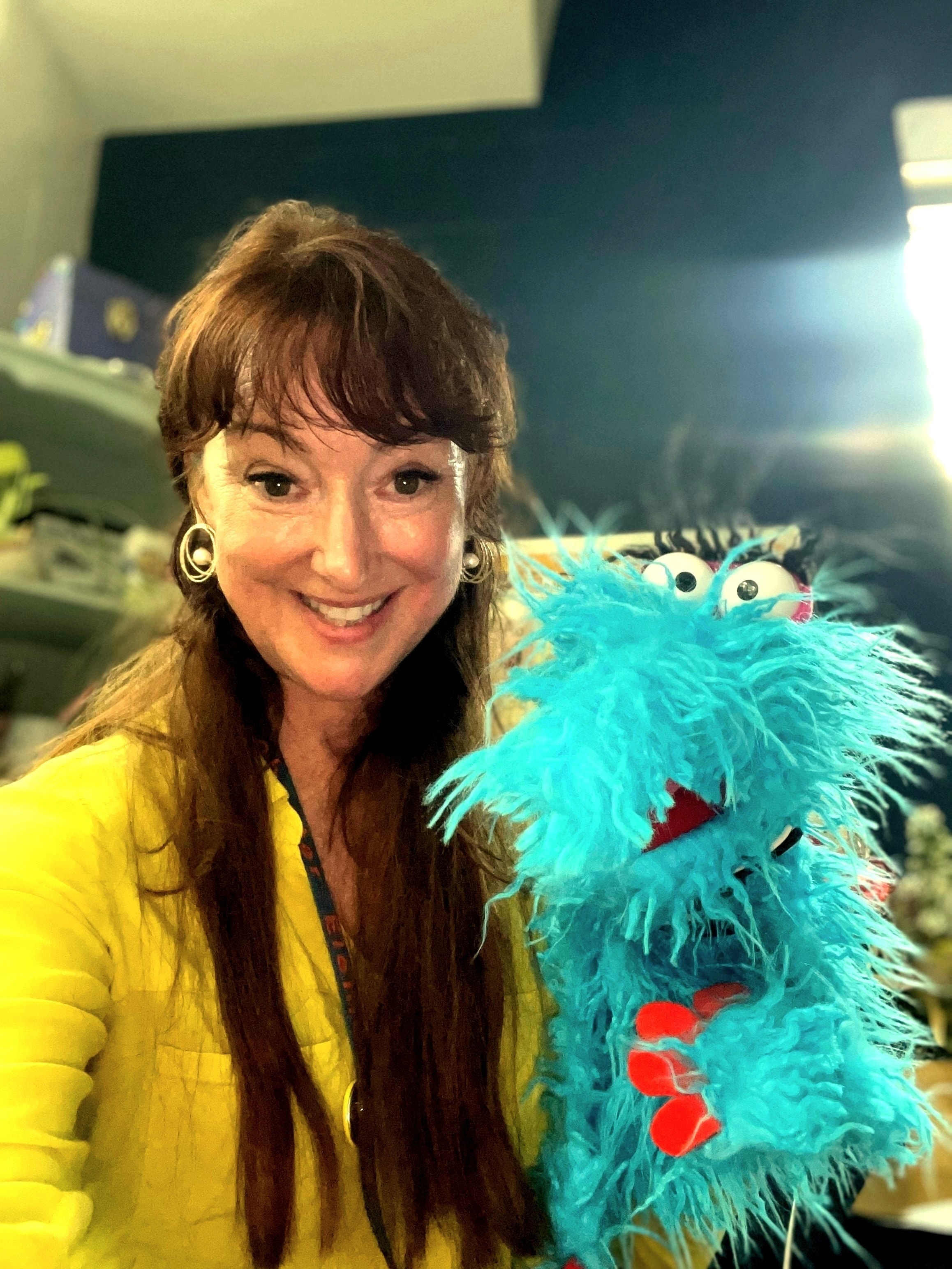 Ms. Renaux with Snort the puppet